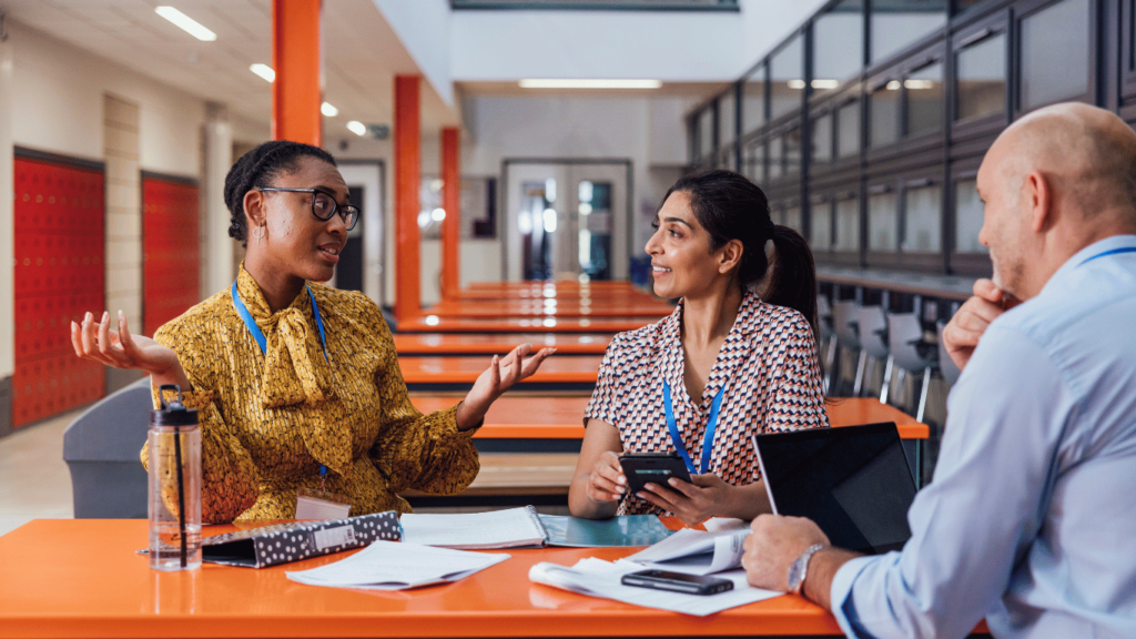 This image shows a group of people working in a school. Edgility’s talent acquisition services help organizations in healthcare, education, non-profit, and beyond find their next leader.