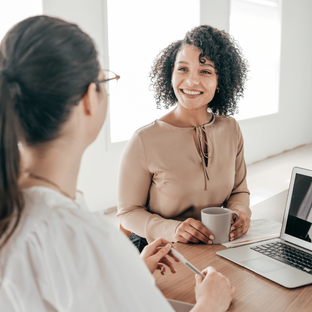 This image shows a woman of color being interviewed. Edgility offers executive search services for small and mid-size firms seeking exceptional leaders.