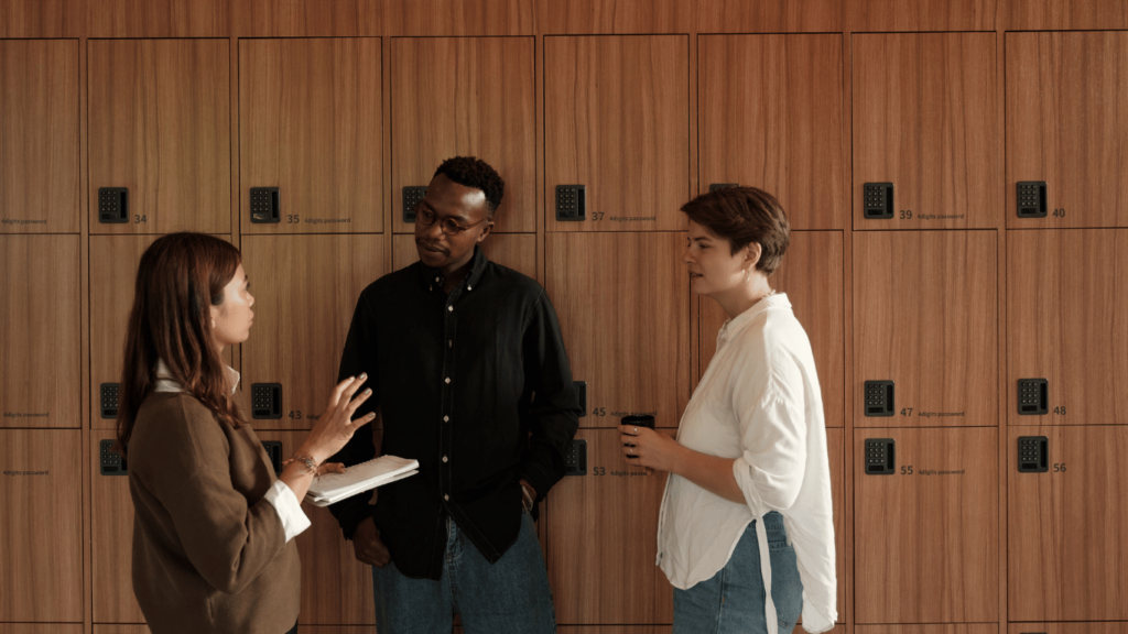 This image shows coworkers in front of lockers. Edgility makes sure your pay structures are fair and competitive.